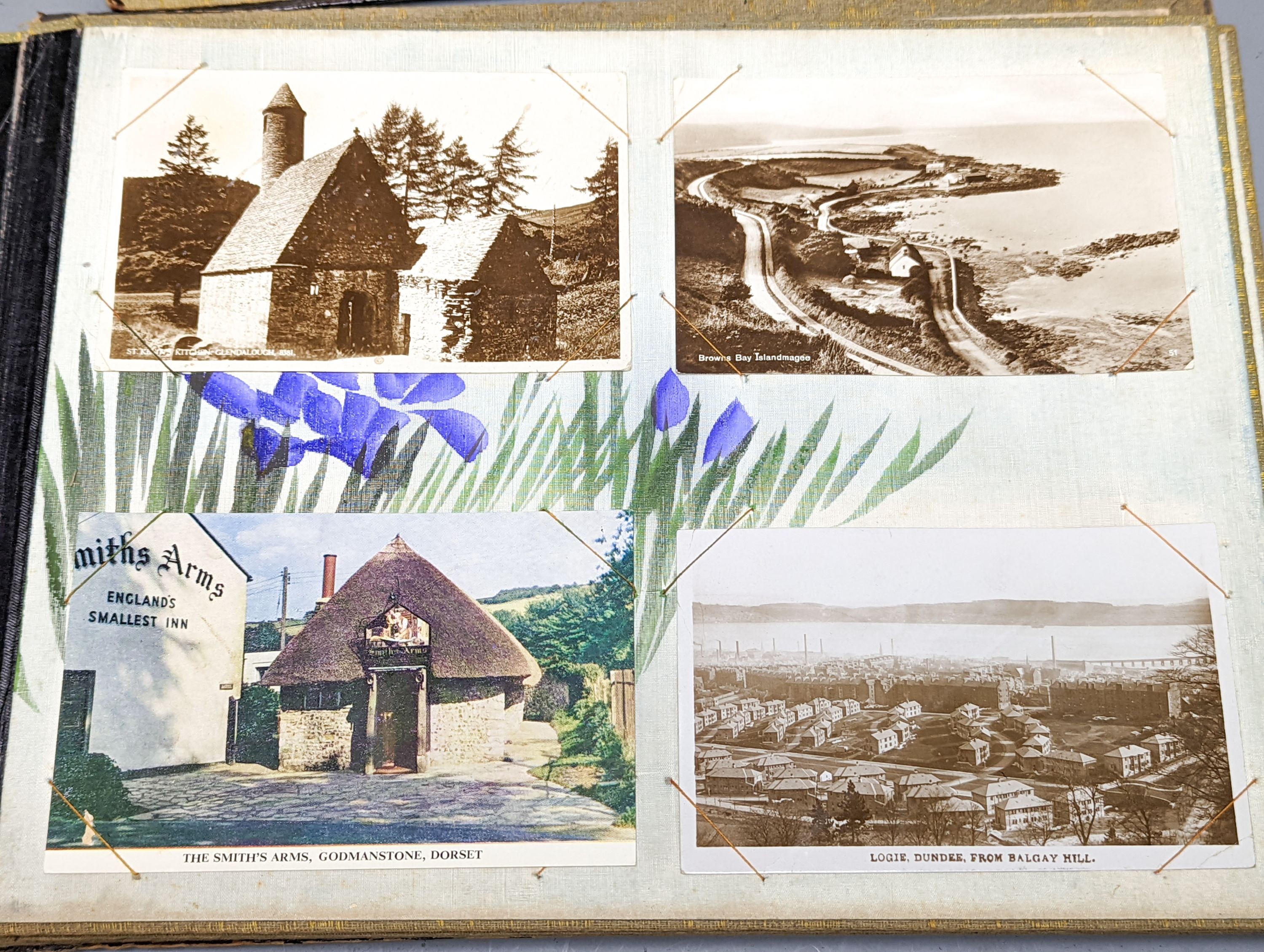 Two early 20th century postcard albums, a photo album and a collection of loose postcards